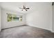 Bright bedroom with a large window overlooking lush greenery at 1308 W Perdiz St, Tampa, FL 33612