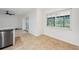 Bright kitchen nook with large window overlooking backyard, granite countertops and stainless appliances at 1308 W Perdiz St, Tampa, FL 33612
