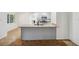 Kitchen island with granite countertops and stainless faucet with sink at 1308 W Perdiz St, Tampa, FL 33612