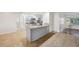 Open kitchen featuring granite countertops, stainless steel appliances and a breakfast bar area at 1308 W Perdiz St, Tampa, FL 33612