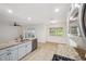 Bright kitchen featuring stainless steel appliances, tile floors and a window for natural light at 1308 W Perdiz St, Tampa, FL 33612