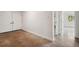 Bright living room with double door entryway and polished concrete flooring at 1308 W Perdiz St, Tampa, FL 33612