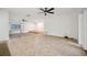 Spacious living room features neutral tile flooring, ceiling fans, and great natural light at 1308 W Perdiz St, Tampa, FL 33612