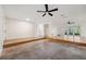 Spacious living room with concrete flooring and multiple entrances at 1308 W Perdiz St, Tampa, FL 33612