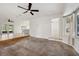 Living room featuring open kitchen and polished concrete floors at 1308 W Perdiz St, Tampa, FL 33612
