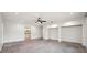 Main bedroom featuring concrete floors, walk in closets, and a bathroom at 1308 W Perdiz St, Tampa, FL 33612