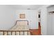 Cozy bedroom boasts terracotta flooring and vintage-style wrought iron bed frame at 1424 Castleworks Ln, Tarpon Springs, FL 34689