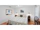 Comfortable bedroom with stylish decor, unique side tables and plenty of natural light at 1424 Castleworks Ln, Tarpon Springs, FL 34689