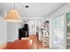 Open-concept kitchen and dining area, filled with natural light and terracotta tile at 1424 Castleworks Ln, Tarpon Springs, FL 34689