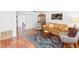 Cozy living room with terracotta floors, stylish furniture and plenty of natural light at 1424 Castleworks Ln, Tarpon Springs, FL 34689
