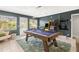 A spacious game room offers a pool table and classic arcade games at 1596 Idle Dr, Clearwater, FL 33756