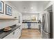 Modern kitchen with stainless steel appliances, sleek countertops, and ample cabinet space at 1596 Idle Dr, Clearwater, FL 33756