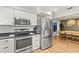 An updated kitchen features stainless steel appliances and ample storage space at 1596 Idle Dr, Clearwater, FL 33756