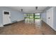 Covered carport features brick flooring with easy access to lake views and the home's entrance at 16019 Chastain Rd, Odessa, FL 33556
