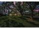 Charming home nestled among mature trees with a well-manicured lawn at 16019 Chastain Rd, Odessa, FL 33556