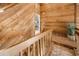 Upper hallway with wood paneling, and a view into rooms at 16019 Chastain Rd, Odessa, FL 33556