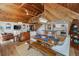 Open concept living room with dining area, kitchen, and wood ceilings at 16019 Chastain Rd, Odessa, FL 33556