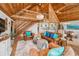 Large living room with wood ceilings, exposed staircase and eat-in Kitchen at 16019 Chastain Rd, Odessa, FL 33556