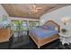 Spacious main bedroom featuring a lake view and private balcony with a hot tub at 16019 Chastain Rd, Odessa, FL 33556