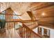 Interior view of stairs with wood ceiling and stone accent wall at 16019 Chastain Rd, Odessa, FL 33556