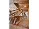 Wooden staircase with detailed railings leading to the upper level of the home at 16019 Chastain Rd, Odessa, FL 33556
