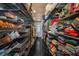Spacious walk-in closet featuring custom shelving for ample storage of clothing, shoes, and accessories at 16019 Chastain Rd, Odessa, FL 33556
