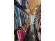 Organized walk-in closet with wooden floors and custom shelving providing ample storage space at 16019 Chastain Rd, Odessa, FL 33556