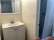Bathroom featuring a white vanity, mirror, and tiled shower with curtain at 1610 58Th S Ave # 6, St Petersburg, FL 33712