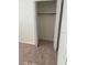 Empty closet with folding doors and a hanging rod at 1610 58Th S Ave # 6, St Petersburg, FL 33712