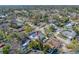 Overhead view of the property and surrounding area showing a pool and neighboring residential homes at 2217 Stacy Ct, Dunedin, FL 34698
