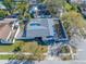 Aerial view showcases the home, situated in a community surrounded by mature trees and well-kept lawns at 2217 Stacy Ct, Dunedin, FL 34698