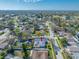 Panoramic aerial shot of the property with a screened pool and its location within the community at 2217 Stacy Ct, Dunedin, FL 34698