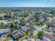 High-angle aerial view of the home's pool area and surrounding neighborhood, displaying its desirable location at 2217 Stacy Ct, Dunedin, FL 34698