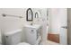 Cozy bathroom featuring a vanity, a mirror, and white fixtures, providing a clean aesthetic at 2217 Stacy Ct, Dunedin, FL 34698