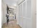 The entryway features a decorative door and tile flooring, creating a welcoming space with a storage closet at 2217 Stacy Ct, Dunedin, FL 34698