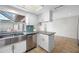 Bright kitchen with stainless steel sink, blue backsplash, and skylight at 2217 Stacy Ct, Dunedin, FL 34698
