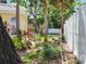View of the home's backyard featuring mature trees and a privacy fence at 2512 W Texas Ave # C, Tampa, FL 33629