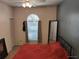 Bedroom with a window, a large mirror and a built in closet at 2512 W Texas Ave # C, Tampa, FL 33629