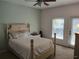 Bedroom with natural light, a white bed, and access to a patio area at 2512 W Texas Ave # C, Tampa, FL 33629