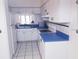 Functional kitchen featuring white cabinets and ample counter space at 2512 W Texas Ave # C, Tampa, FL 33629
