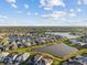 Stunning aerial view of a residential community featuring lakes and lush greenery at 2577 Buckthorn Loop, North Port, FL 34289