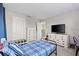 bedroom with bed, dresser and TV at 2577 Buckthorn Loop, North Port, FL 34289