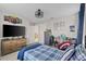 bedroom with bed, desk, dresser and TV at 2577 Buckthorn Loop, North Port, FL 34289