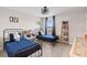bedroom with 2 beds, ceiling fan and blue curtains at 2577 Buckthorn Loop, North Port, FL 34289