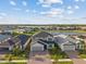 Beautiful two-story home with well-manicured lawn and a lake in the neighborhood at 2577 Buckthorn Loop, North Port, FL 34289