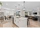 Gourmet kitchen with center island, stainless steel appliances, and seamlessly connecting to the breakfast and living areas at 2577 Buckthorn Loop, North Port, FL 34289