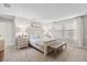 Calm main bedroom with neutral colors, soft carpet, and ample natural light from the window at 2577 Buckthorn Loop, North Port, FL 34289
