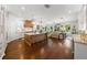 Spacious open-concept kitchen with large island, pendant lighting, and hardwood floors at 3117 W Lawn Ave, Tampa, FL 33611