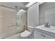 Well-lit bathroom featuring a bathtub with a shower, a toilet, and a sink at 322 Northway Dr, Sun City Center, FL 33573