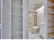 Bathroom featuring built-in shelving, a shower, and a skylight at 322 Northway Dr, Sun City Center, FL 33573
